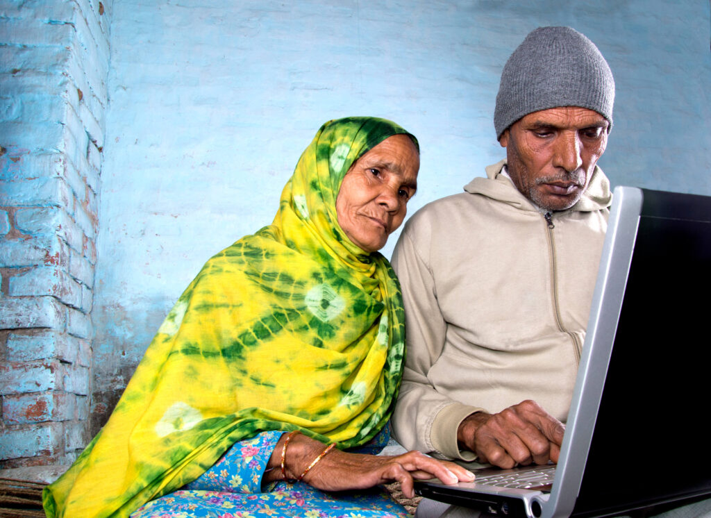 man and woman using a computer