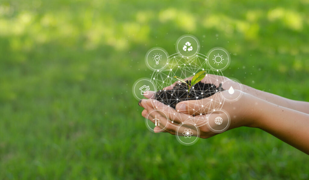 hands holding dirt and sprouting plant with icons