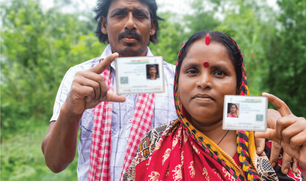 People holding up identification cards