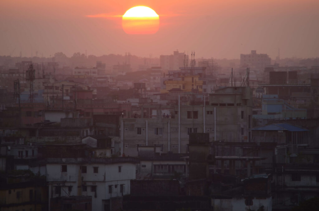 Sun rising over a city