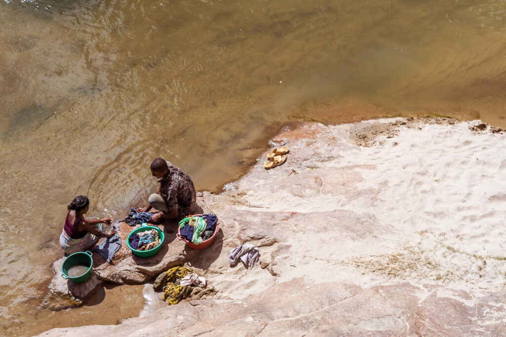 People washing clothes in a river