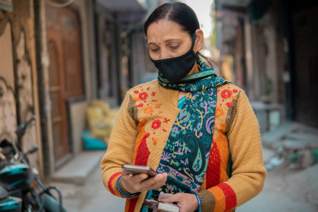 Woman on phone wearing face mask