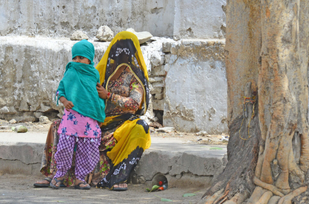 Woman and child outside on concrete