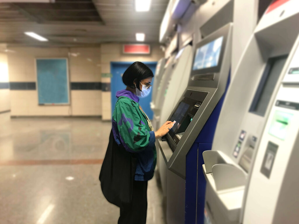 Woman using ATM