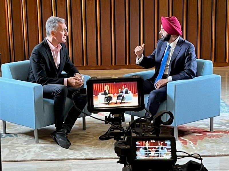 President and CEO of Accion, Michael Schlein, and The World Bank President, Ajay Banga, filming a fireside chat for Financial Inclusion Week 2023.